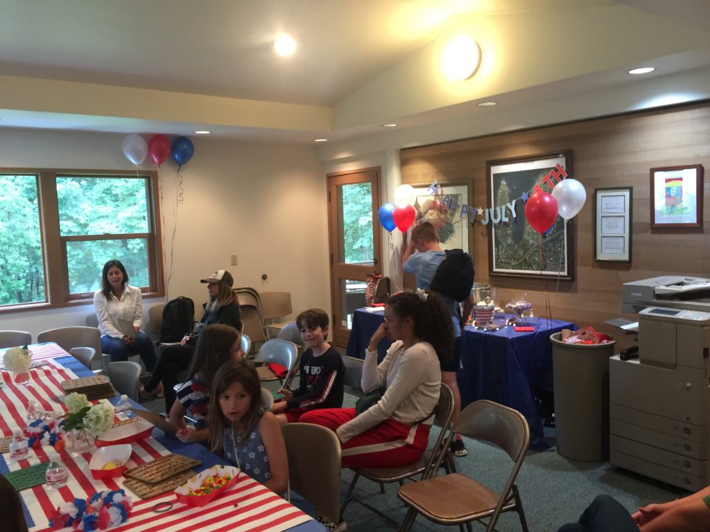 Indoor patriotic party with children and balloons