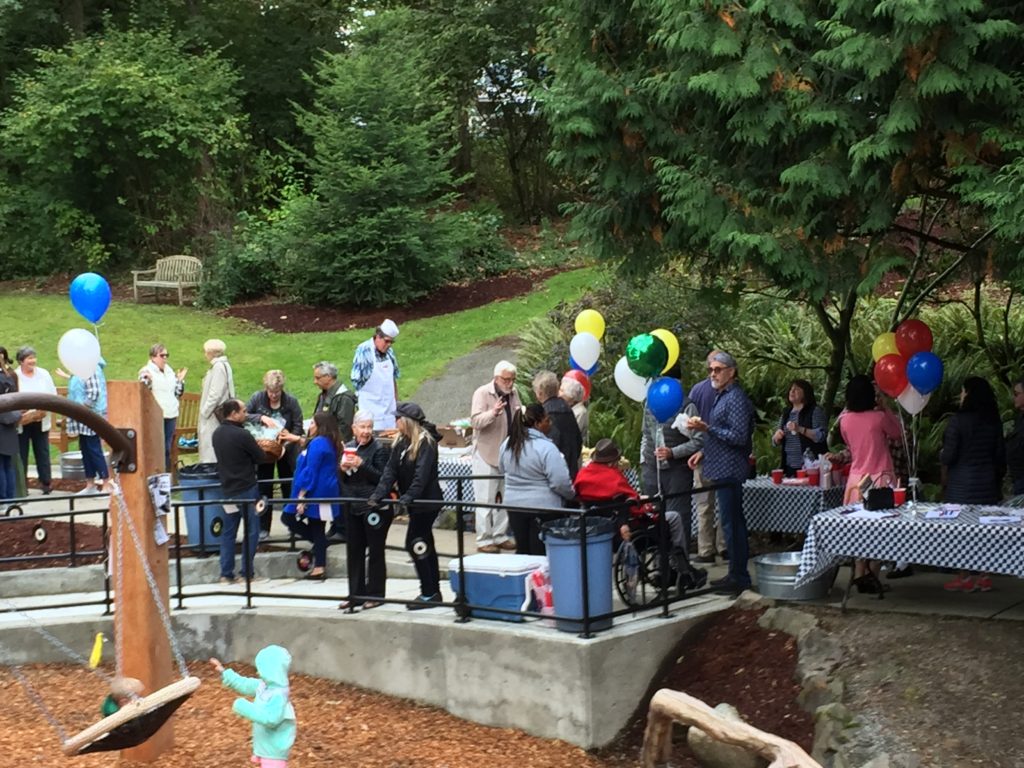 Outdoor community picnic with balloons