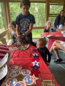 Children playing bingo with patriotic decorations