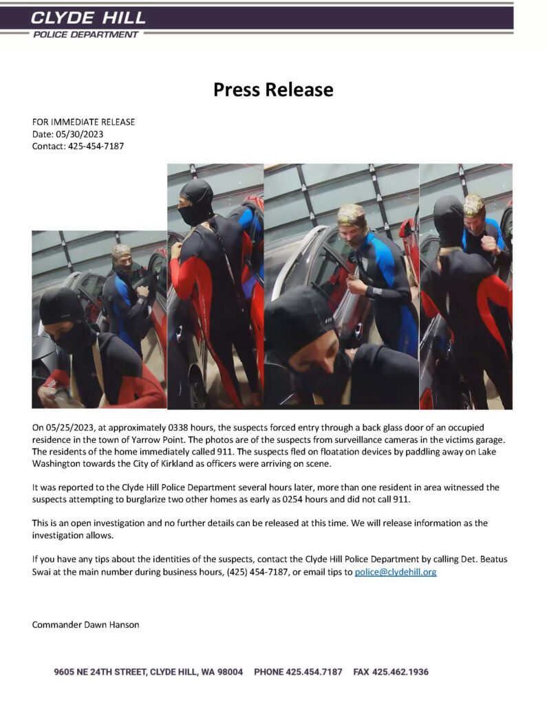 Three masked suspects in wetsuits entering garage